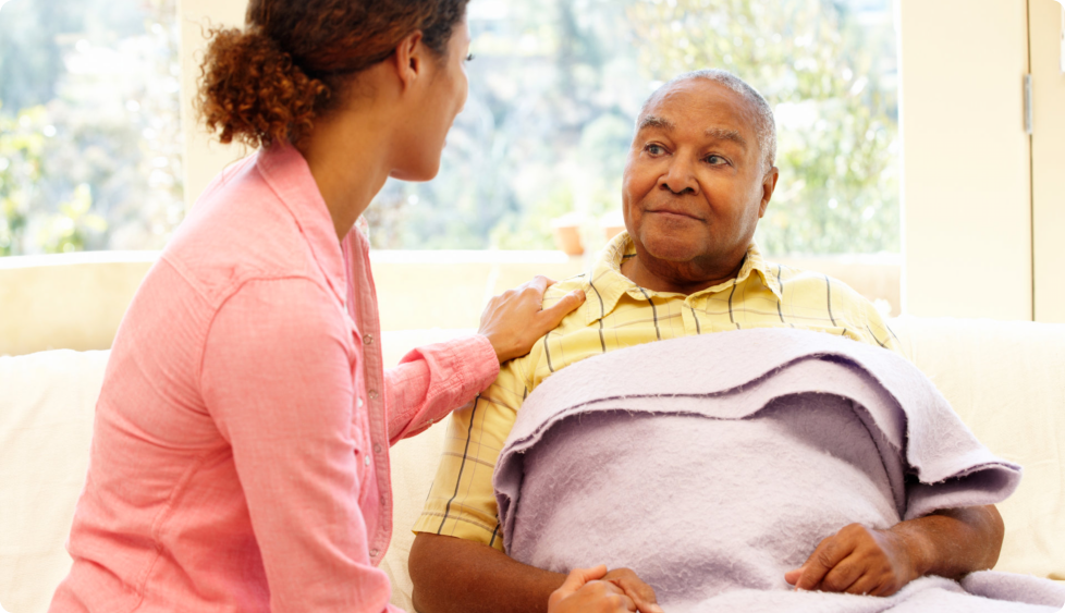 caregiver encourage the old man to get well